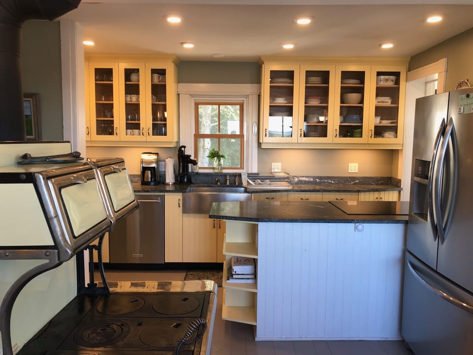 Wood stove w renovated kitchen. glass-top stove & fridge with filtered H20 & ice
