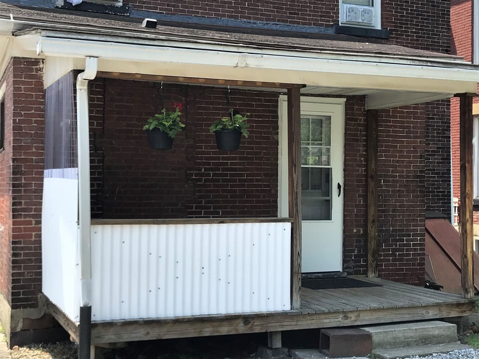Private entrance and porch.  Parking next to porch.