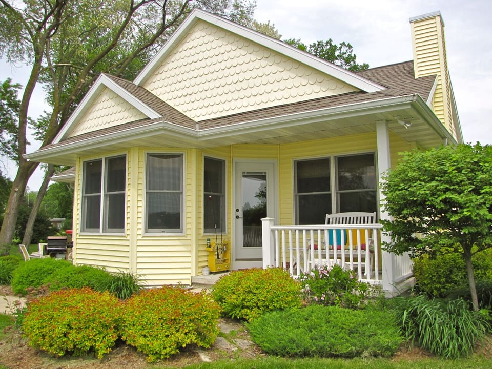 Sunset Nook Cottage is nestled nicely on a beautiful, level lot leading to the water.