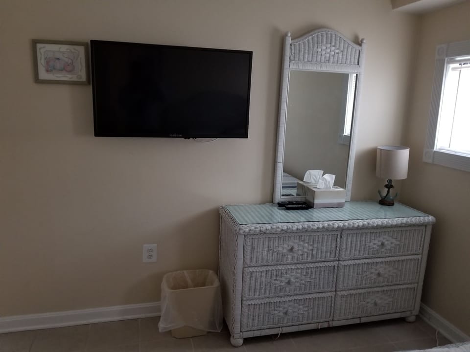 Guest bedroom with wall mounted 42 inch flat-screen TV