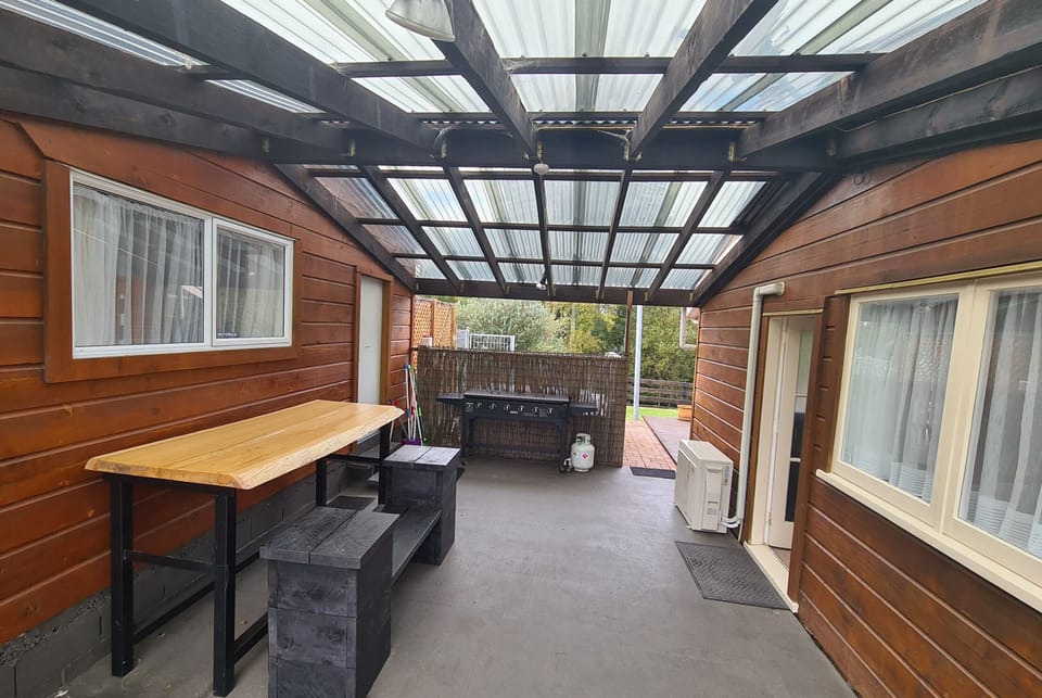 Cottage carport separating Cabin
