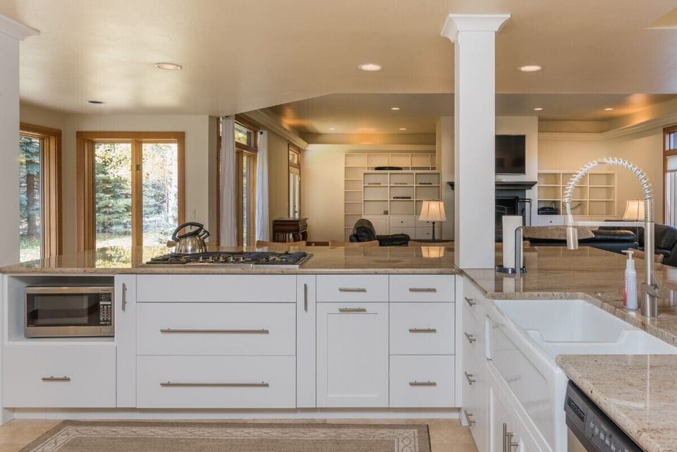 Farmhouse sink and professional gas cooktop
