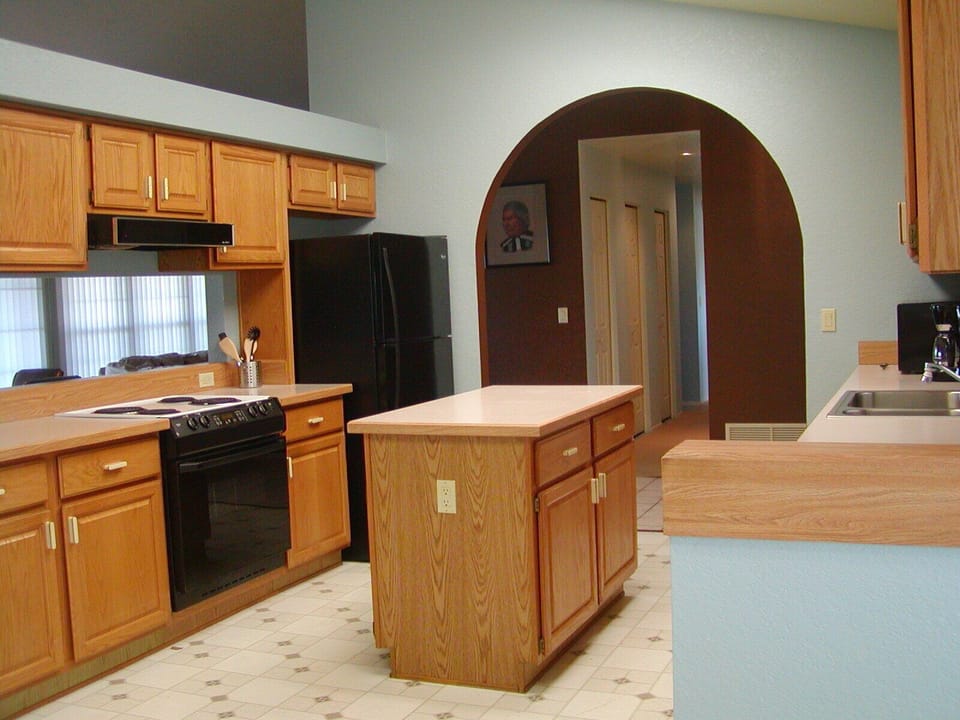 Large kitchen with plenty of cookware and new appliances