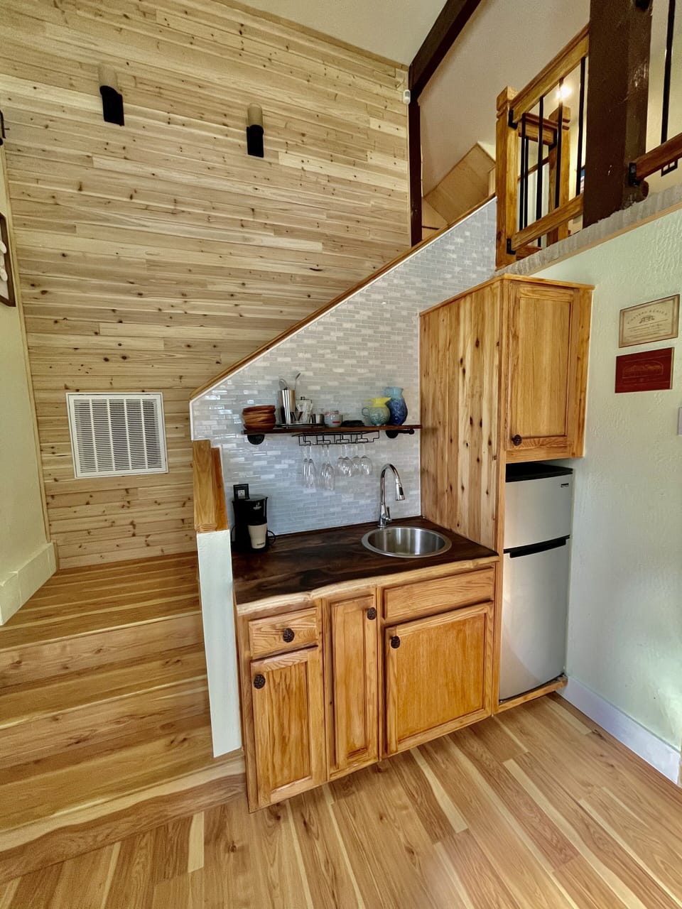 Wet bar with multiple kitchen appliances, sink and Breville smart mini oven