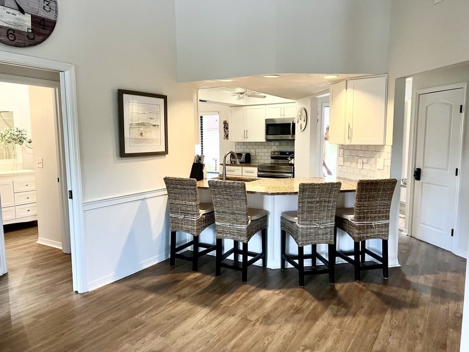 Breakfast Bar is open to the kitchen. Entry to the Guest Suite is on left.