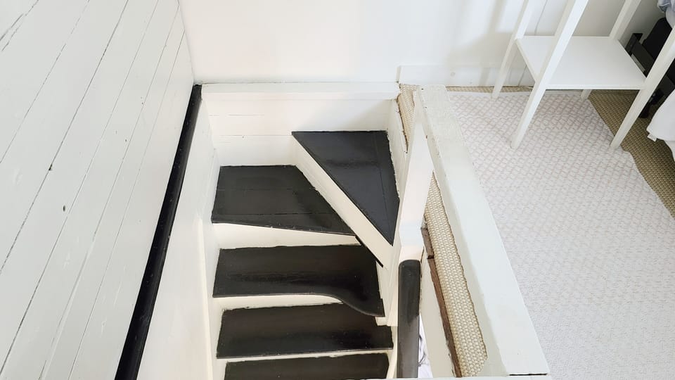 Stairs leading down from master bedroom to main floor