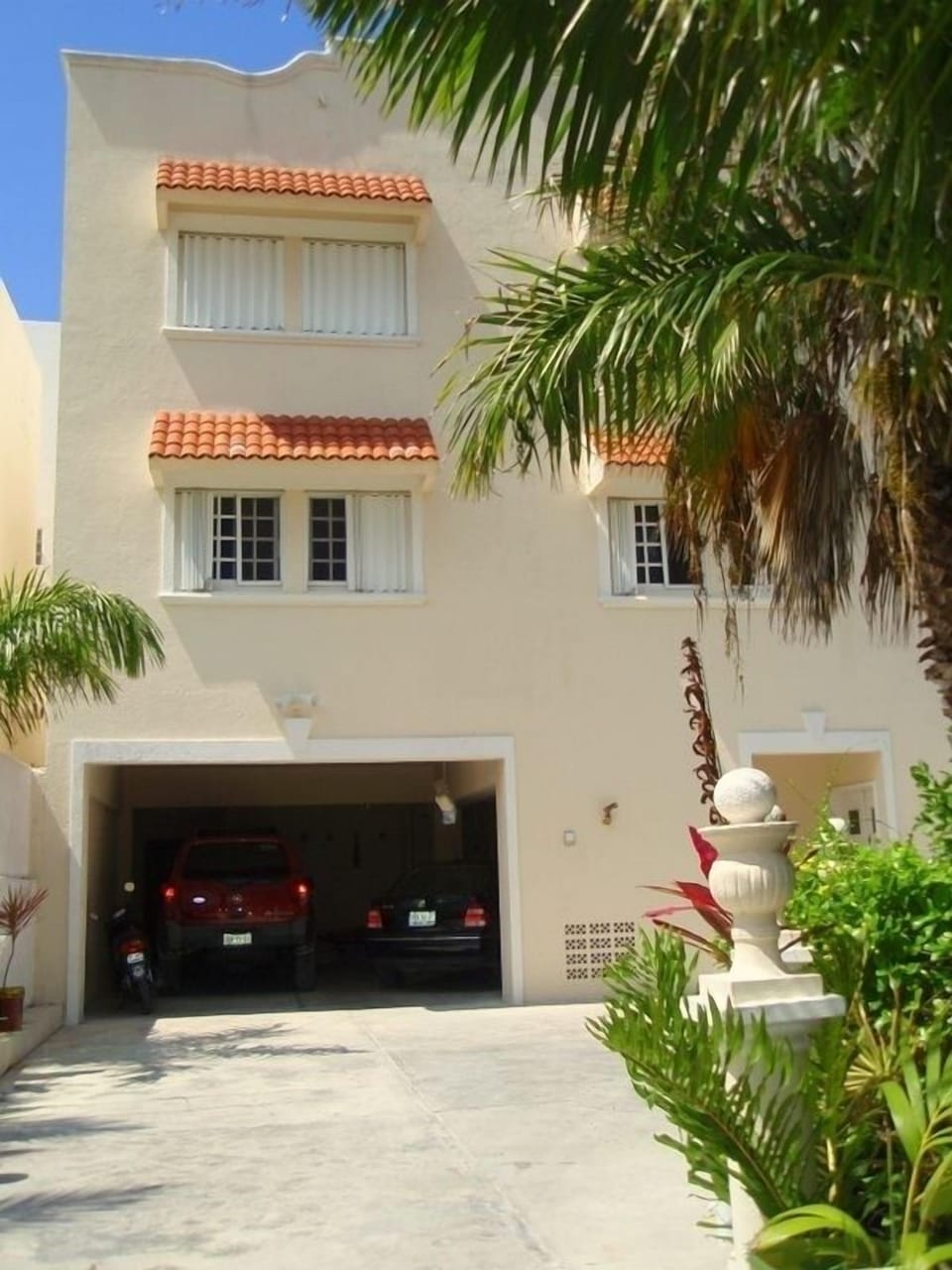 Owner's park in the garage but you may park to the right.  Back of Villa Dos.