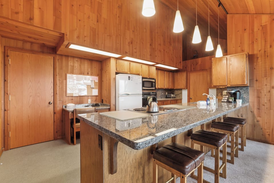 Kitchen area with bar stools for 4.