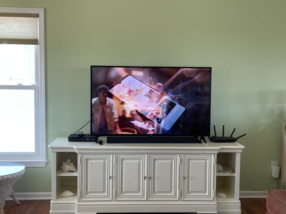 4K UHDTV with 2.1 channel sound bar (connect via Bluetooth to your own tunes)