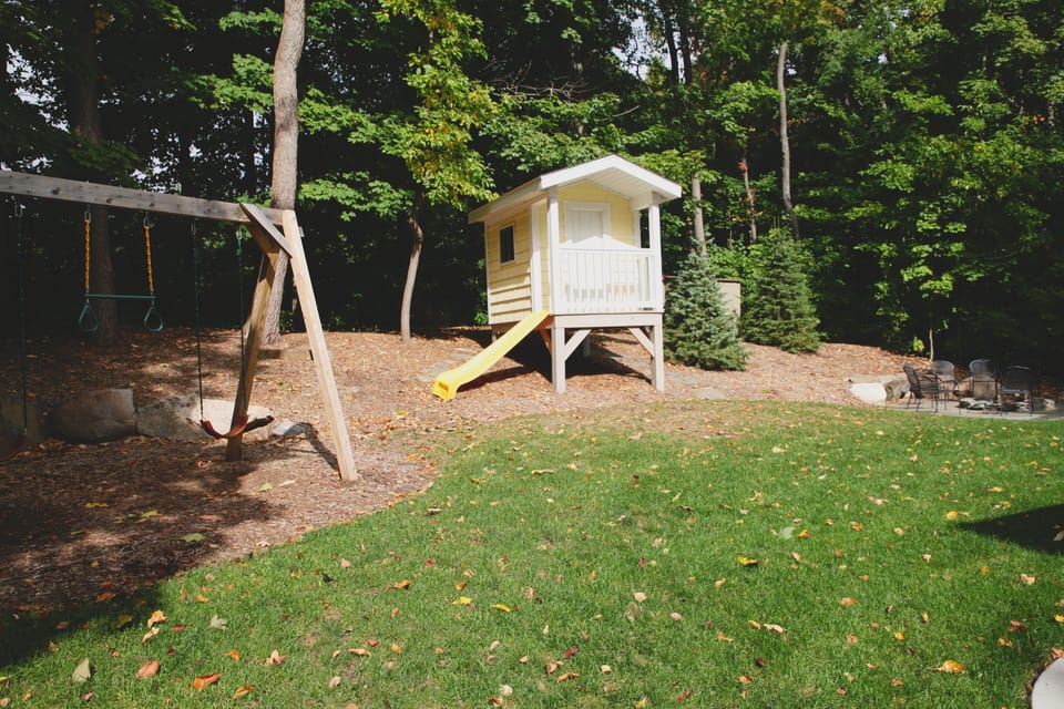 Kid's swing set and play house with slide