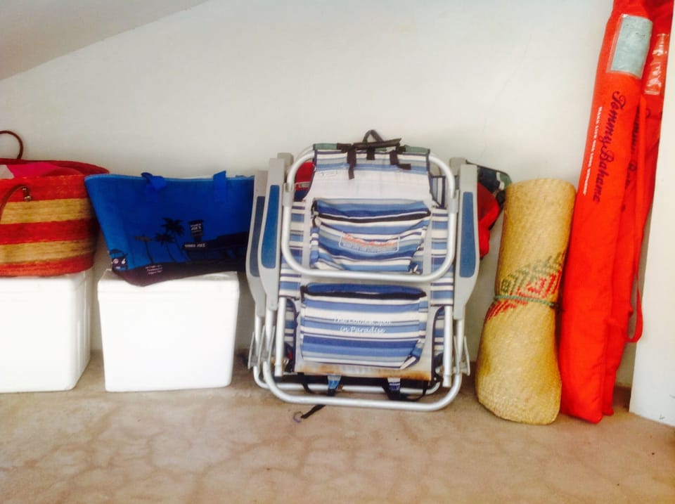 Four Tommy Bahama beach chairs, two large umbrellas, coolers, towels etc...