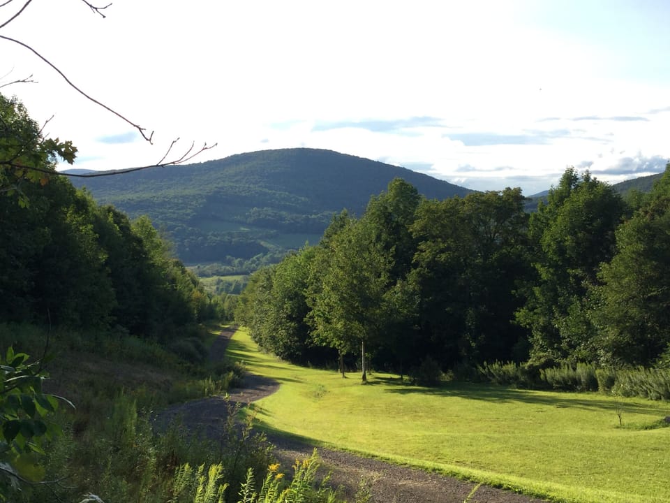 0.7 mile private road to barn. AWD or 4WD required in winter (plowed after snow)
