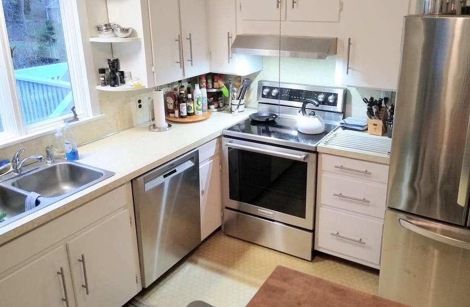 Country kitchen with updated appliances and chef tools
