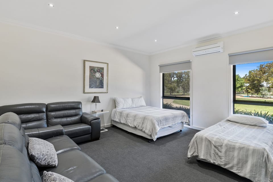 Bedroom 5/Lounge (at entry)  -  1 QS Bed &1 single -fits 2 trundles, incl plasma