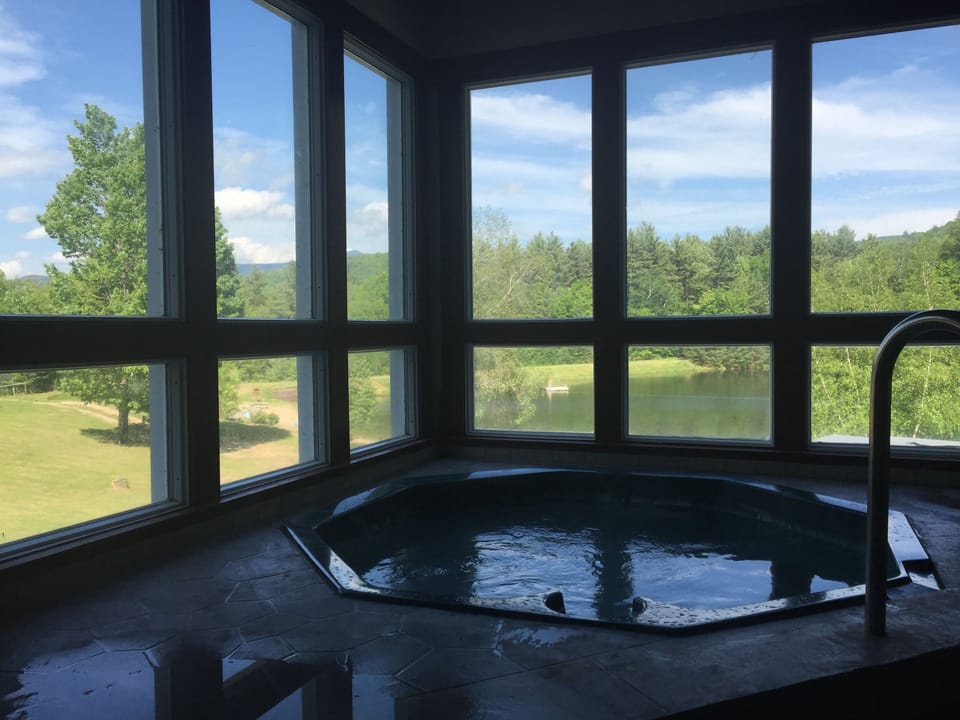 Indoor hot tub looking out to the White Mountains