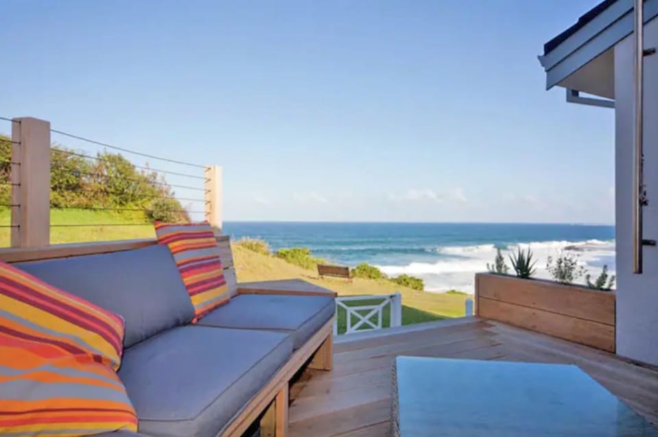 The open plan kitchen flows onto a deck