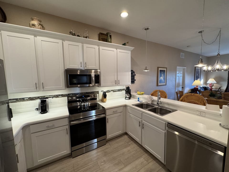 Our fully-equipped kitchen includes a fridge, stove, dishwasher and microwave.