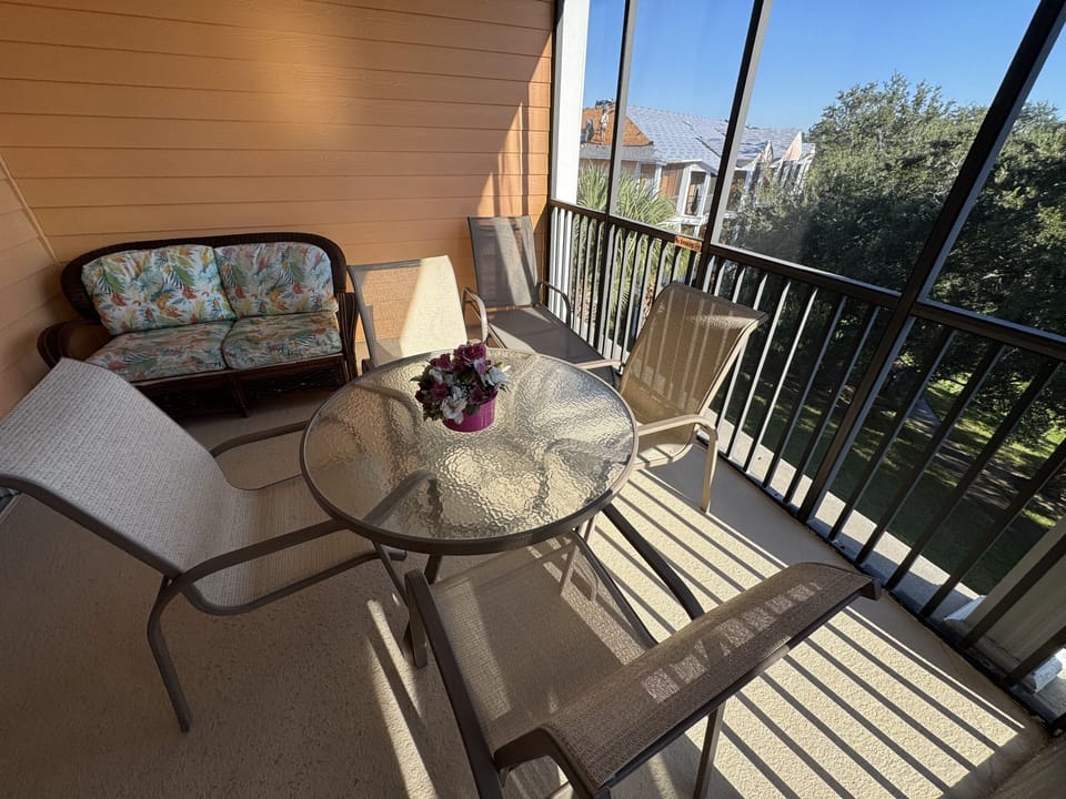 The main balcony off the master bedroom has a table and seating for six.