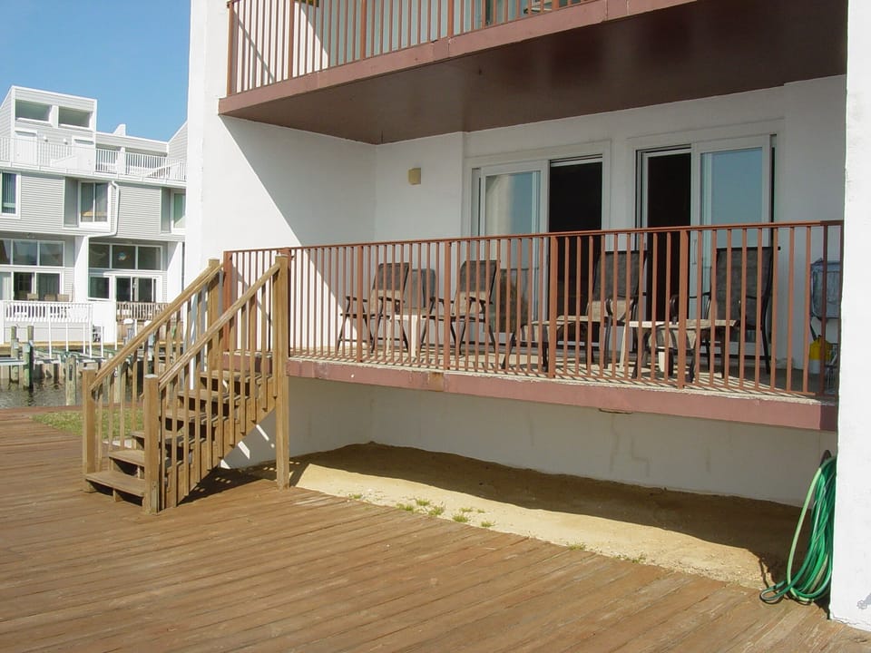 Private balcony just steps from deck/pier. End unit location.