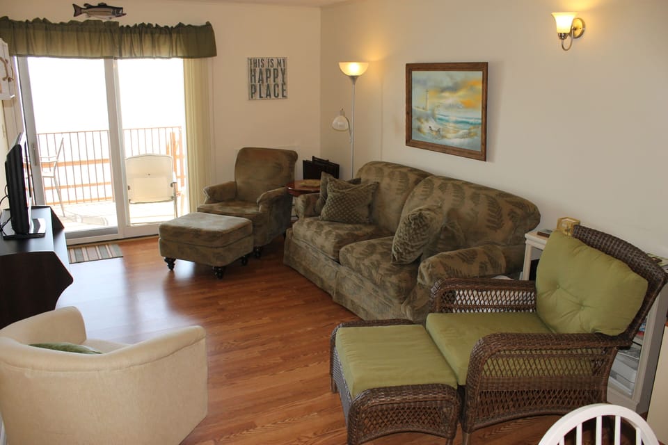 Living room with generous seating, sofa bed and amazing view of the bay.