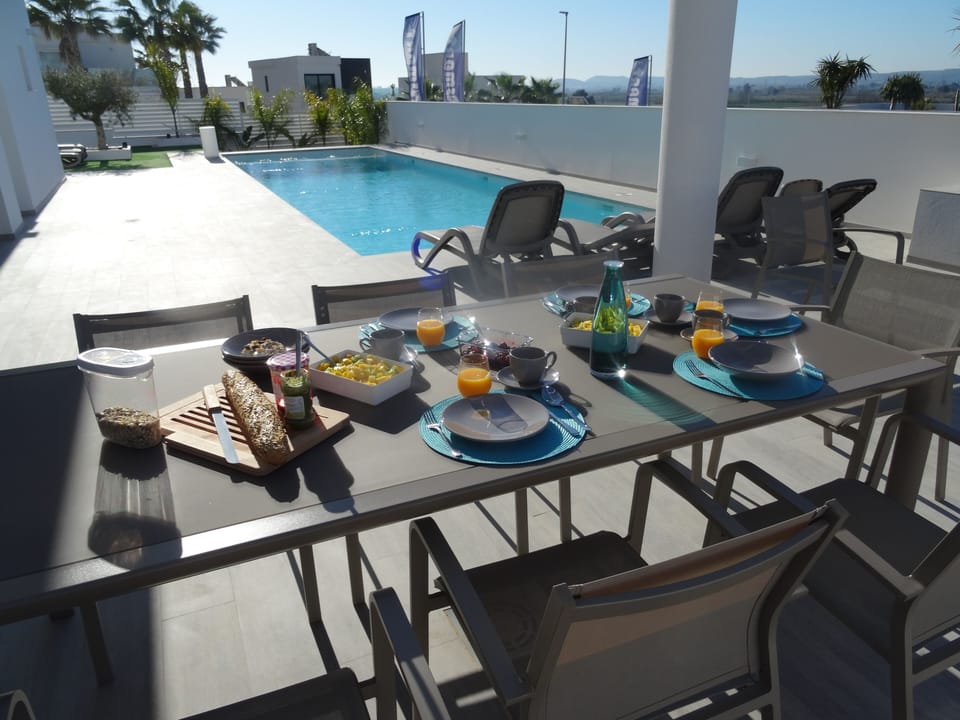 Enjoy breakfast at the pool