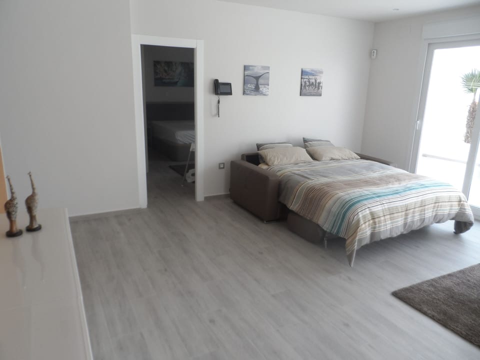 The sofa in the lounge room can be converted to a bed. 