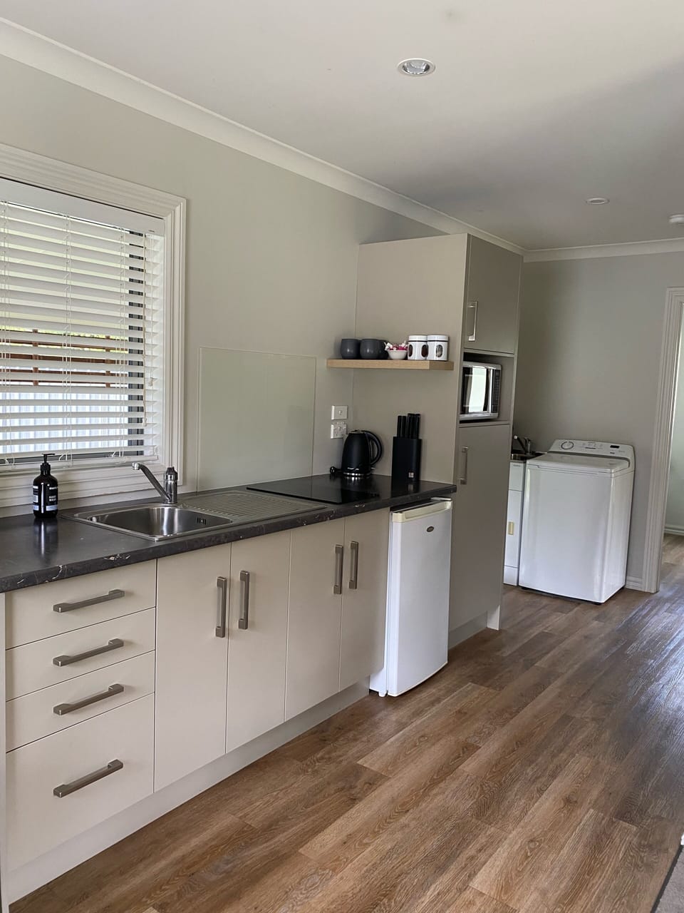 Kitchen and laundry by the entrance door
