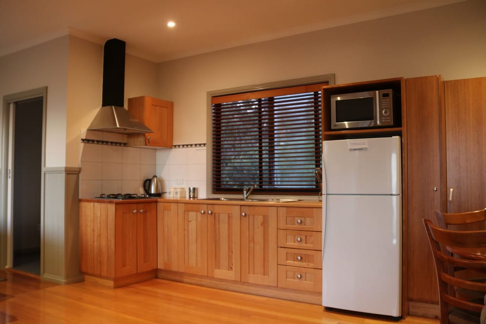 Modern kitchen with lots of extras, but no oven.
