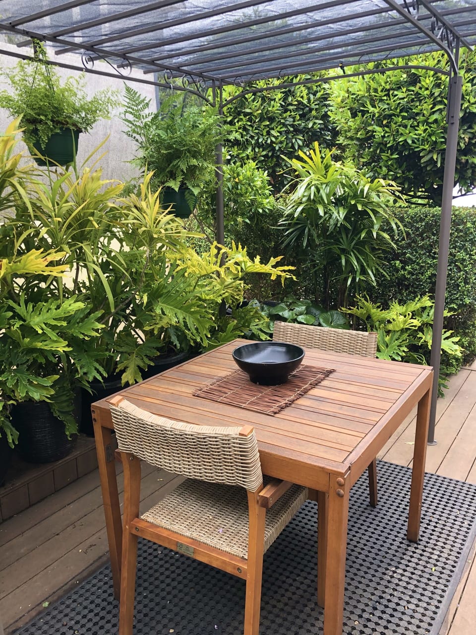 Sheltered outdoor eating area at the front of the apartment 