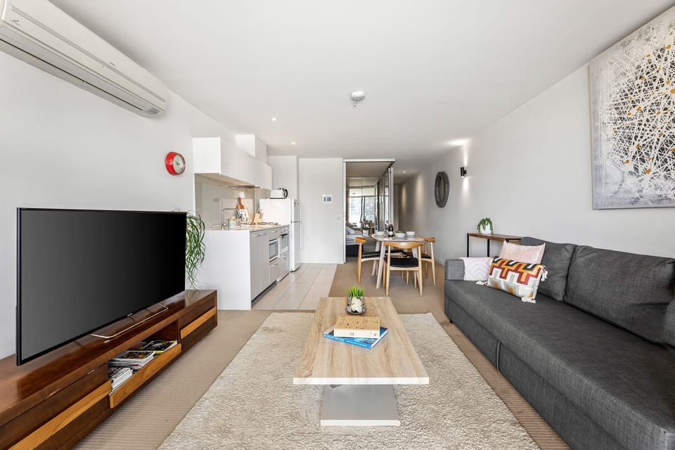 Living area - 3 seater Sofa Bed, large Coffee Table, Sony 55" Smart TV 