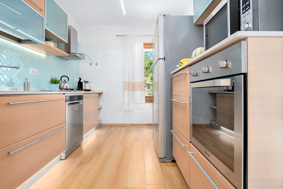 The bright fully equipped kitchen of villa Veronica, Sardinia