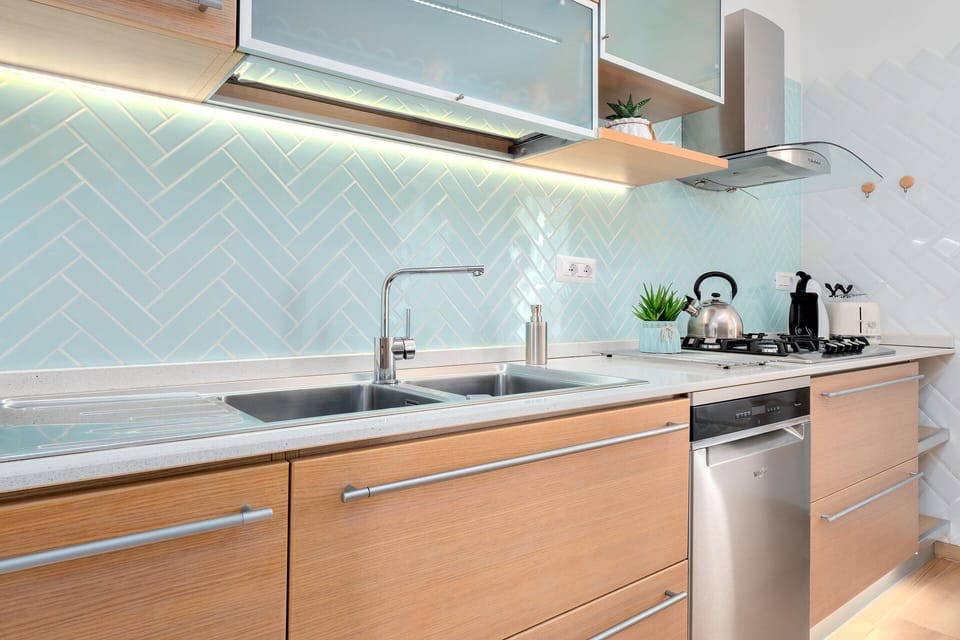 Sink, cooker and dishwasher in the kitchen of villa Veronica, Sardinia