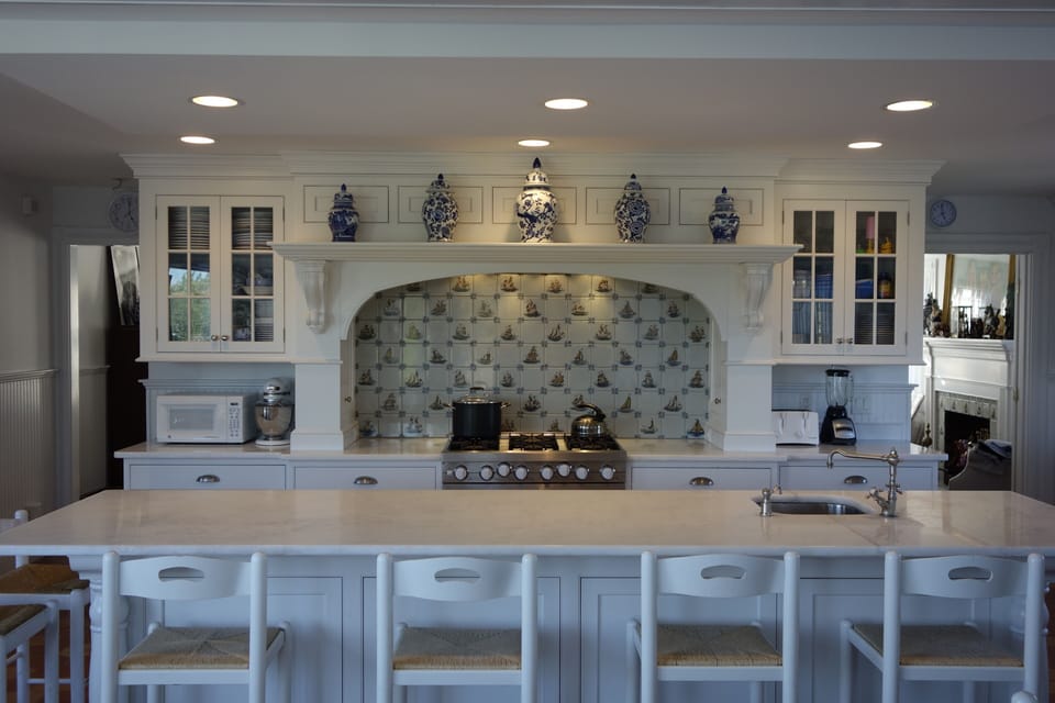 The fully equipped kitchen has an 11-foot marble island with seating for 8-10.  