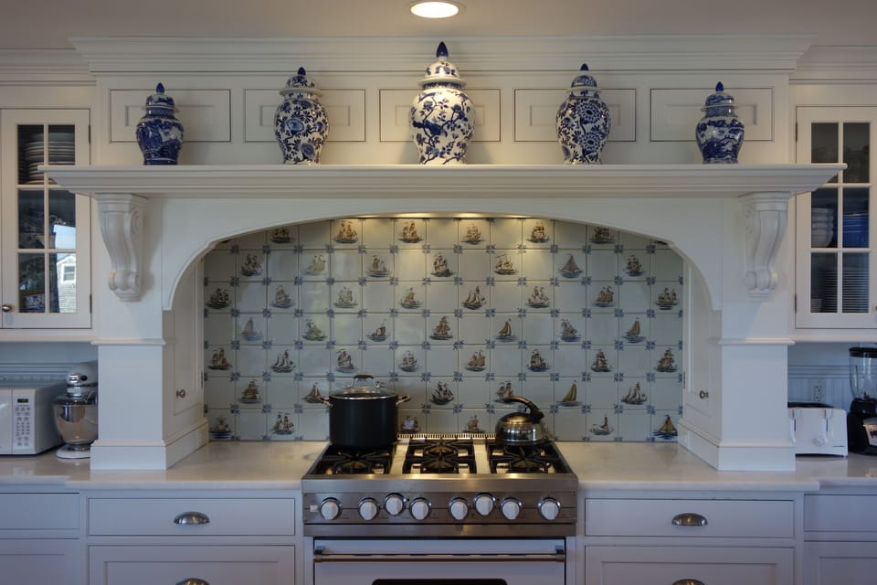 Boat-themed backsplash is pretty & unique in the fully equipped chef's kitchen