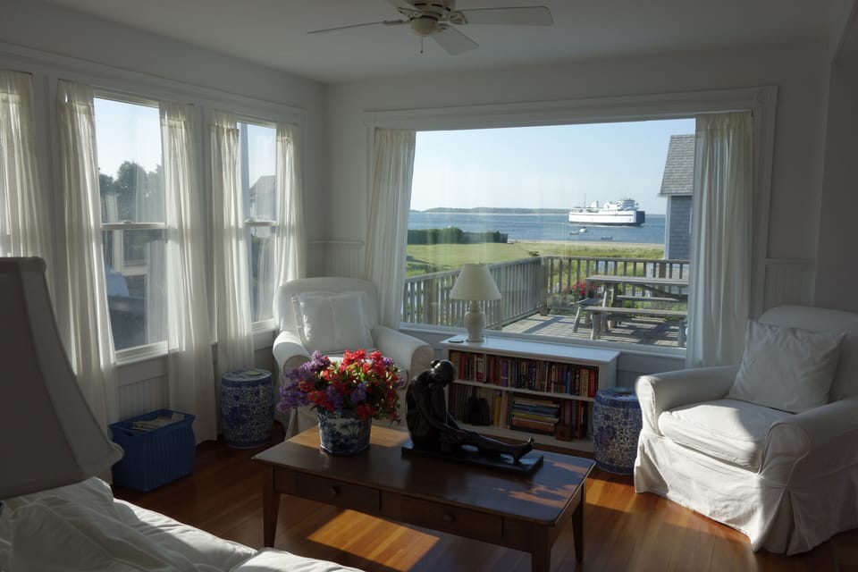 Living room in kitchen , with a big deck w/ picnic table...and that view!