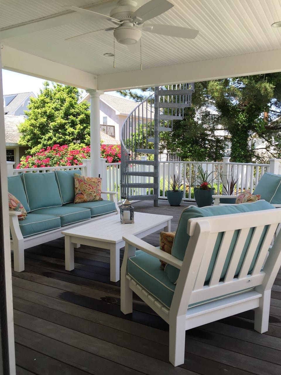 Fully Furnished Lower Back Deck with View of Back Yard.