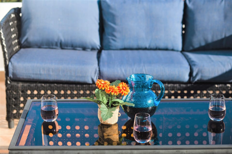 Enjoy a drink with friends at the rooftop bar with seating for 15 