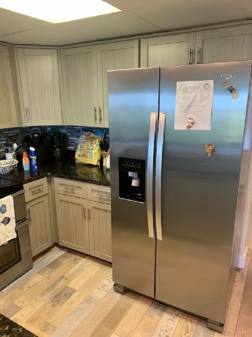 Kitchen with new (2021) laminate flooring, all appliances replaced 2020.