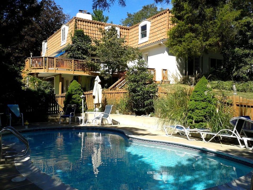 Heated Pool with enclosed fence and cement decking