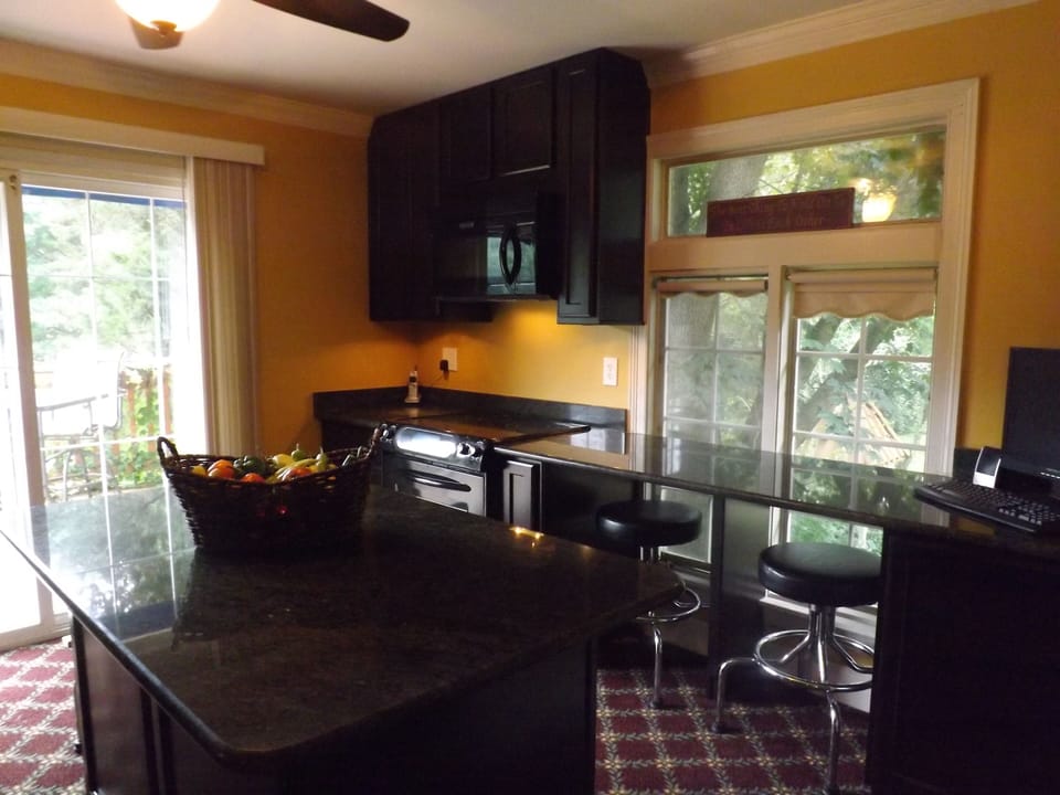 Gourmet kitchen with island and walk out deck