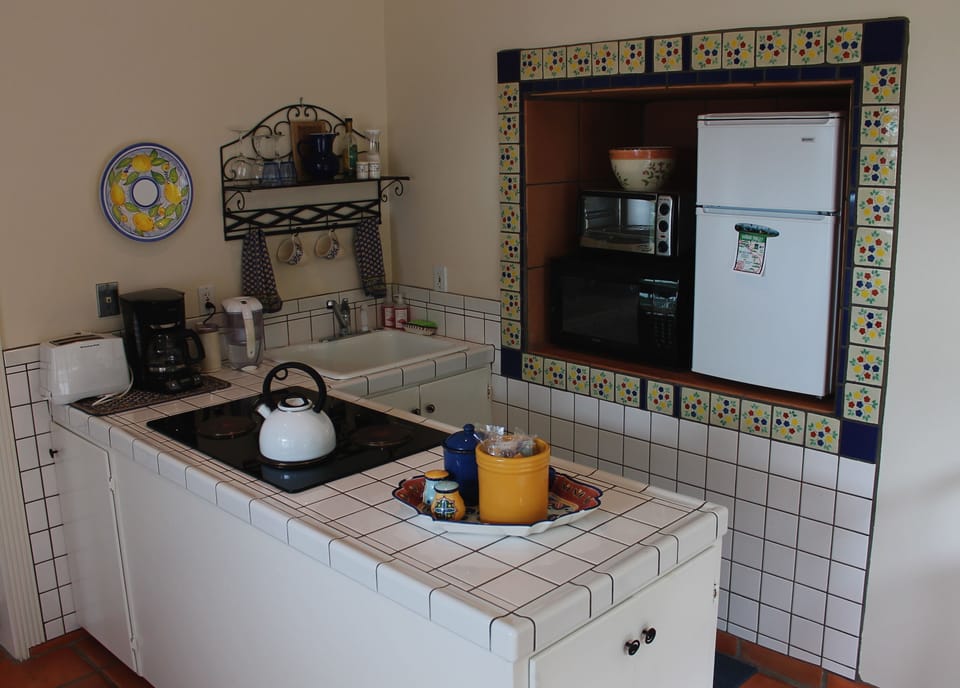 Kitchenette with stove-top, fridge, microwave, and all kitchen supplies