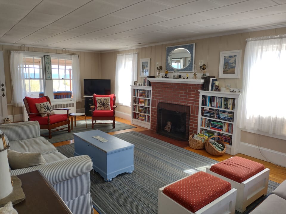 The living room is stocked with books for all ages, puzzles, and games.