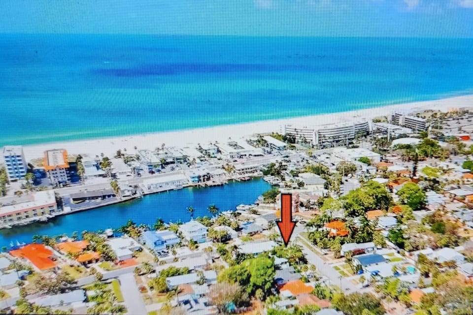 Tucked a block into desirable Belle Vista, walk to beach, restaurants and stores