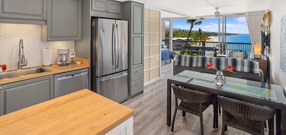 Fully stocked kitchen with a view! 🍳👩‍🍳 New flooring thruout condo and lanai!