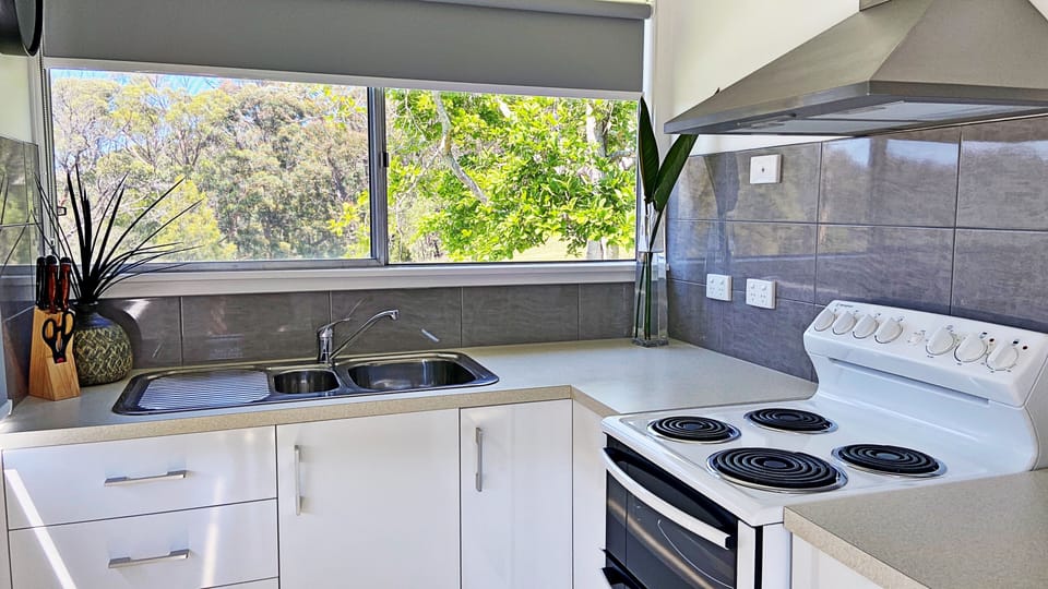 Fully equipped kitchen fitted with oven, pantry & full size fridge