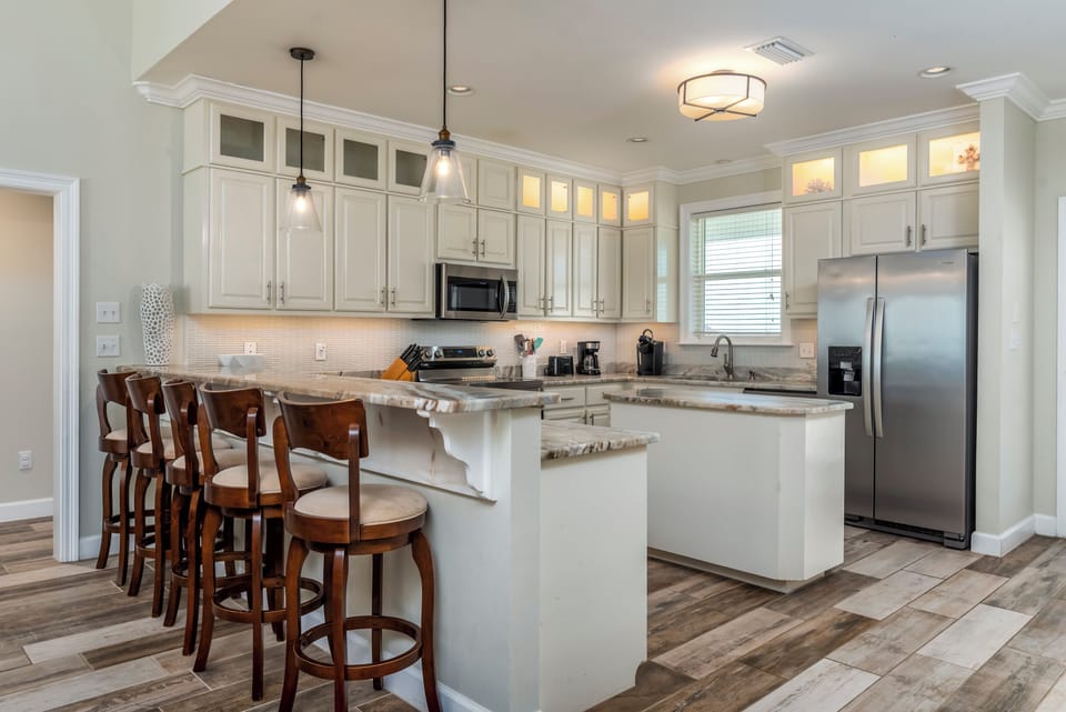 Your gourmet kitchen awaits with granite countertops, stainless appliances, and breakfast bar seating for memorable meals together.