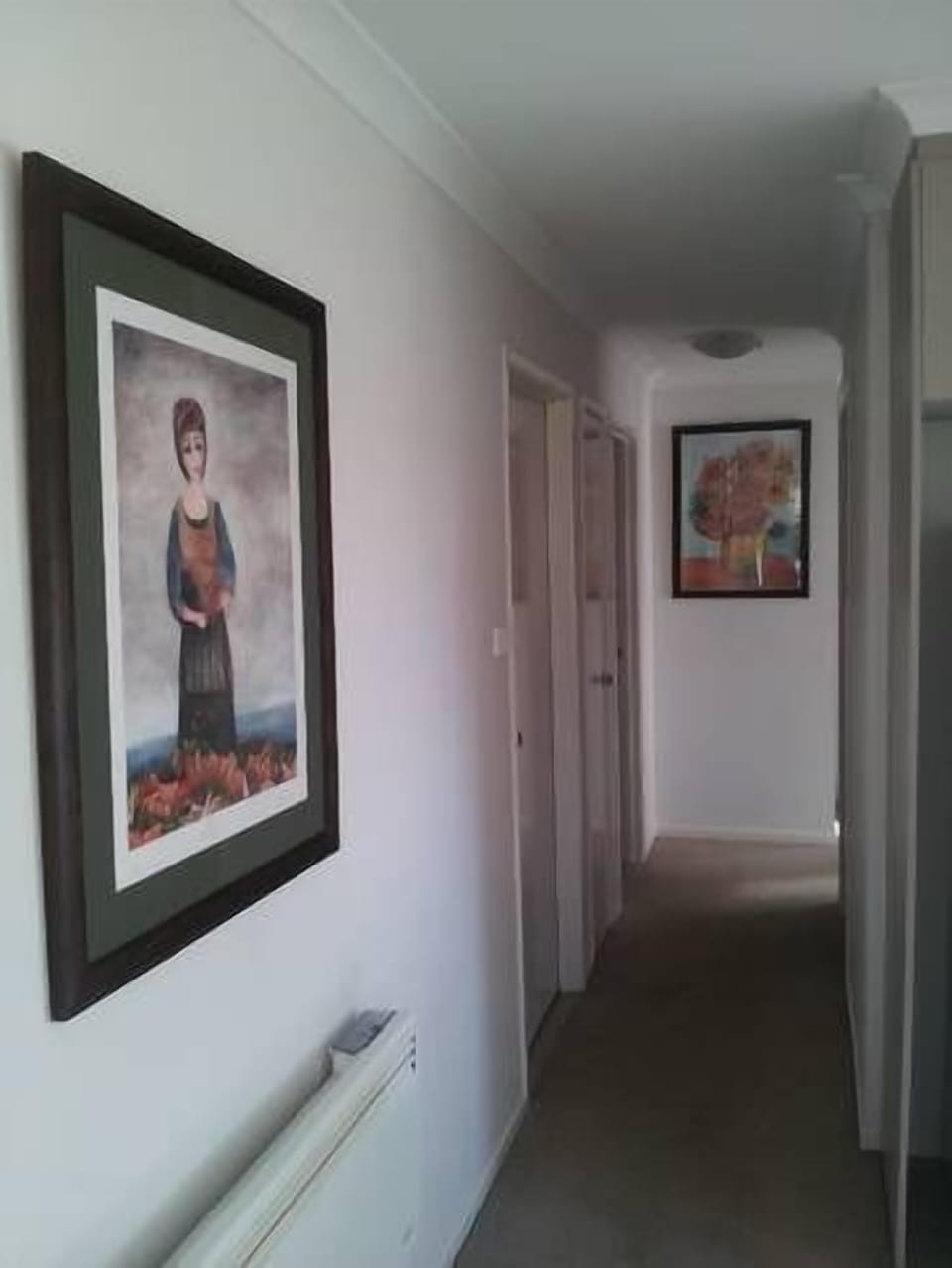 Hallway to bathroom and separate toilet.