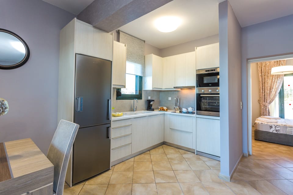 The open plan area features the living room, dining area and kitchen!