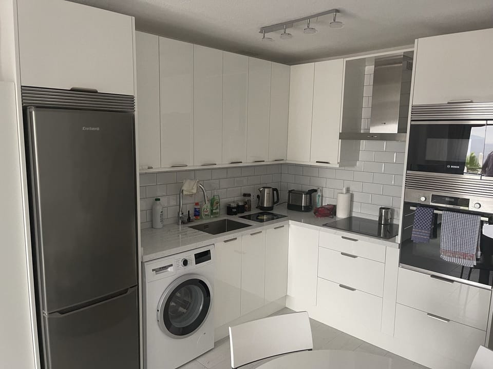 Fully Renovated Kitchen with Granite, Bosch Appliances, & Integrated Microwave.