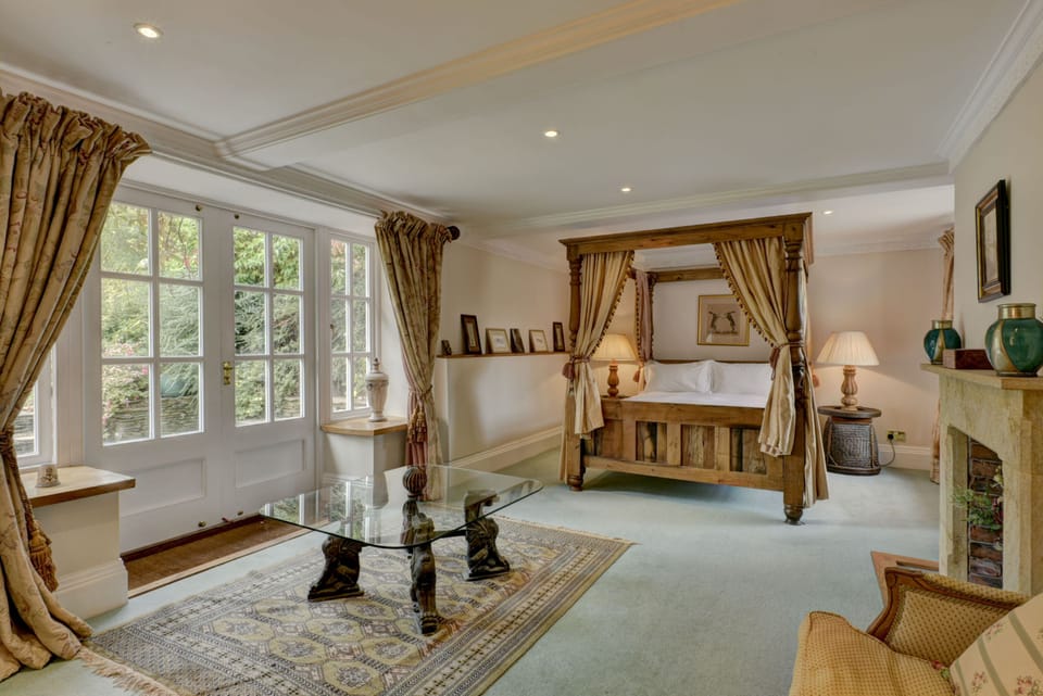 Stable Room, with four poster, private terrace and en-suite bathroom.